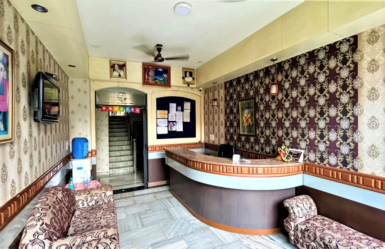 A clean and serene private room at Anagha Yoga School.