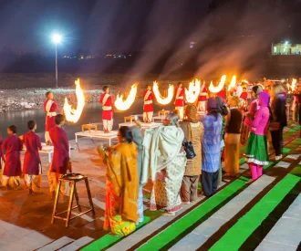 Evening Ganga Aarti ceremony on the banks of the Ganges in Rishikesh.