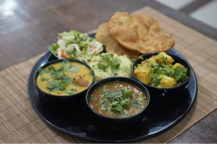 A colorful and healthy Sattvic meal served on a traditional plate.